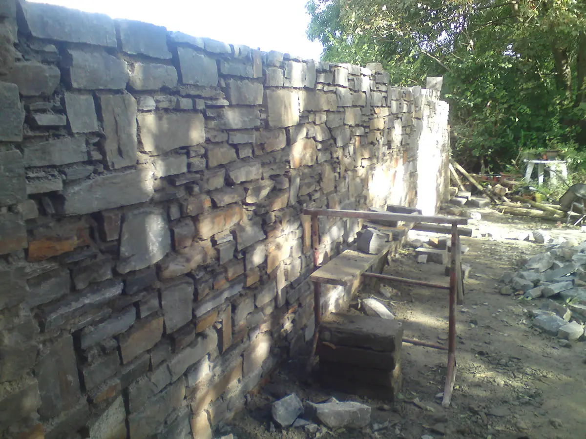Traditional stone wall by Quinn Masonry